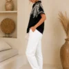 5d46a8d2-7670-4e3f-abf5-15044a2c9e31 Zwarte Damesblouse met Goud Borduursel