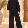 Zwart dames vrijetijdspak met knoopdetail Zwart dames vrijetijdspak met knoopdetail